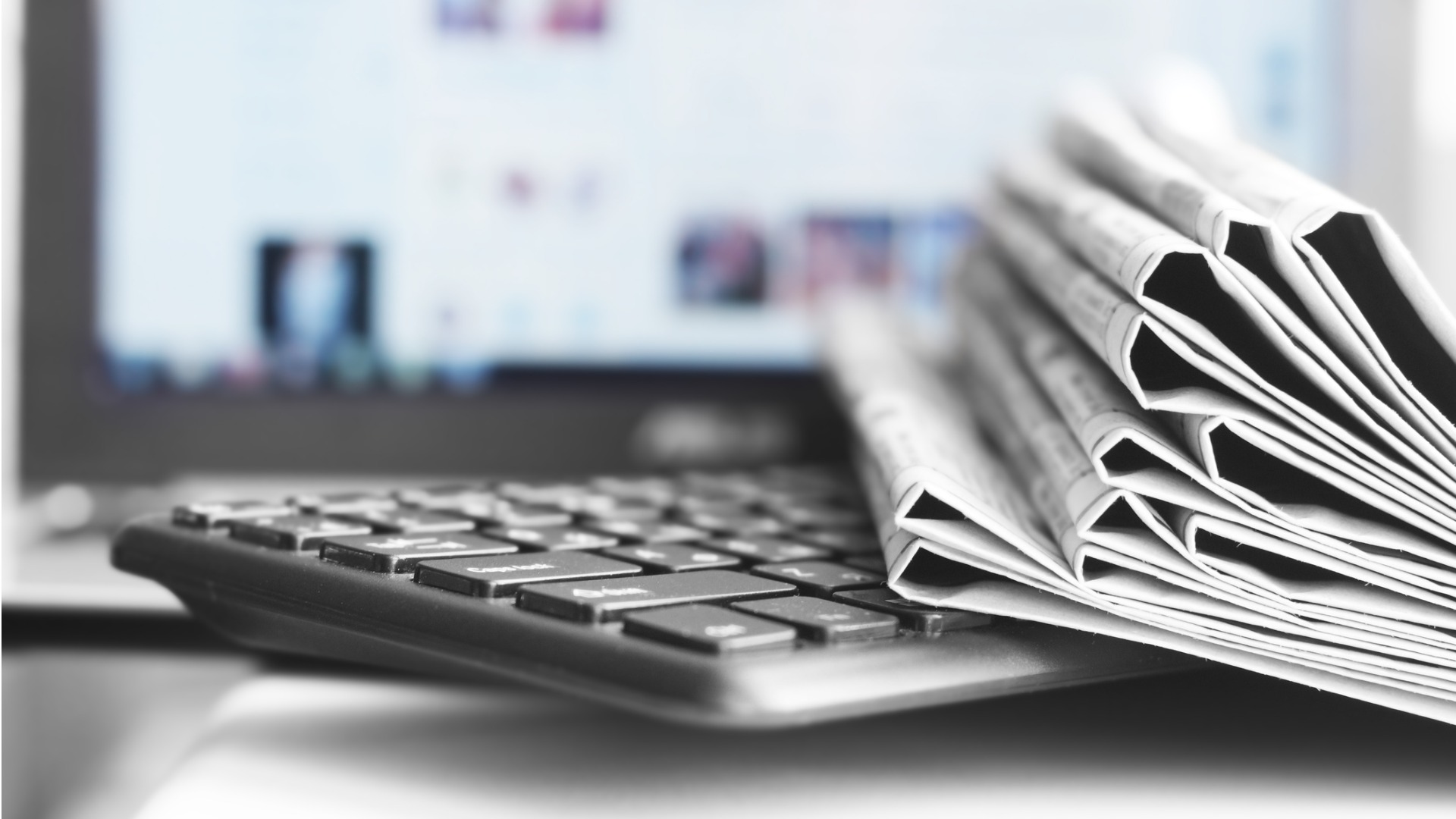 newspapers-and-laptop-istock
